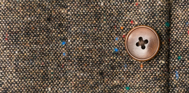 Nahaufnahme eines braunen Tweed Stoffs