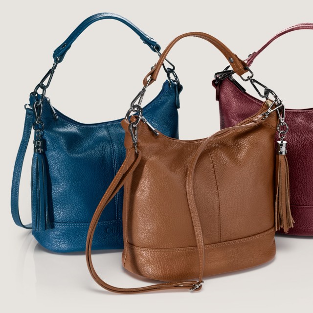Drei Ledertaschen in verschiedenen Farben